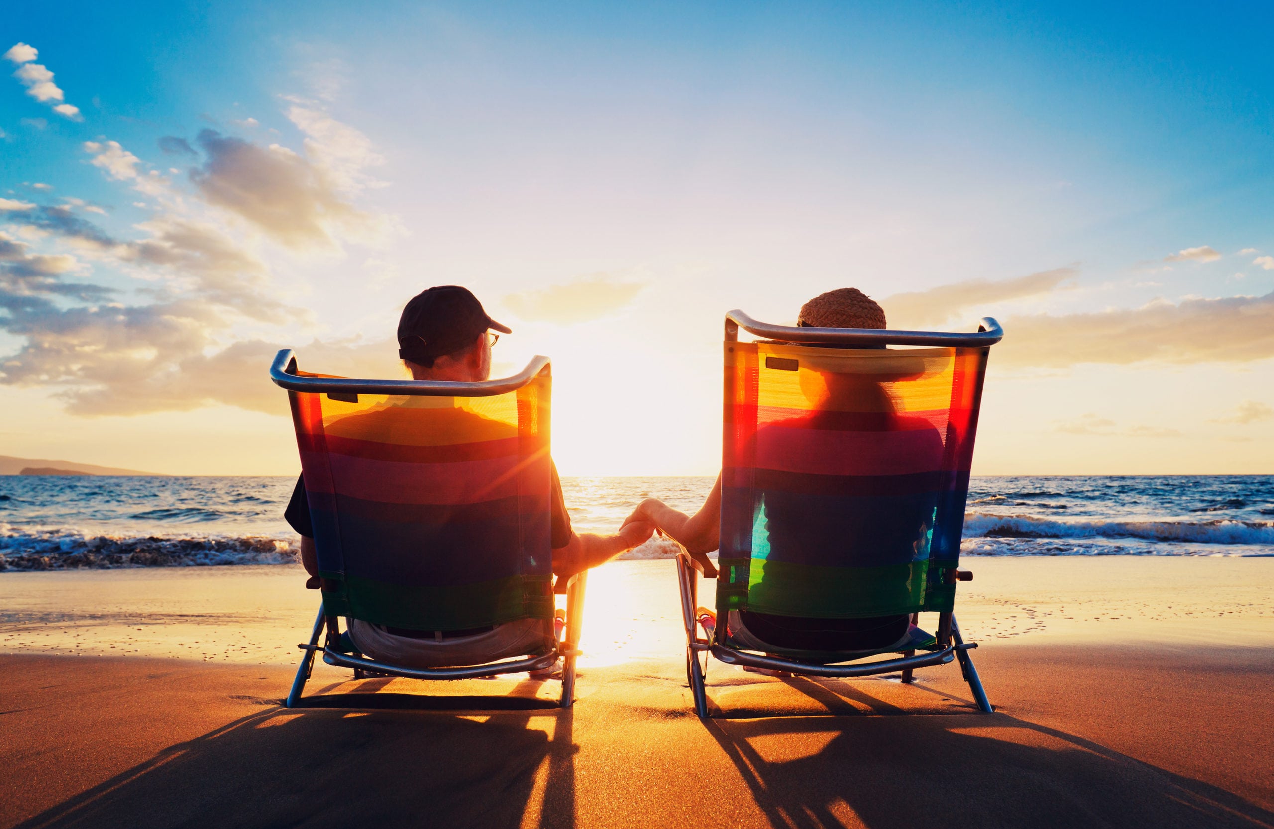 Couple on the beach with chairs